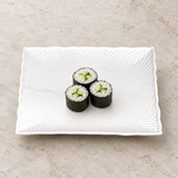 7.25-inch white textured square porcelain plate with three small cucumber maki