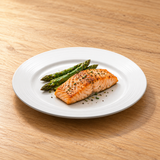 10.5-inch white ceramic ridged-rim round plate with a modest four-inch salmon fillet and three asparagus tips