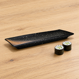 A0399-BR long black and rust ceramic plate beside sushi