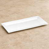 White plate on a neutral stone tabletop, same-view context