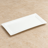 White plate on a neutral stone tabletop, same-view context
