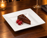 A1008 white square ceramic plate with chocolate cake and raspberries.
