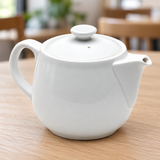 A10989 white ceramic teapot in a table setting
