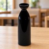 A1830-B black ceramic sake bottle in a table setting