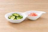 A19474 white porcelain two-well dish with cucumber salad and pickled ginger