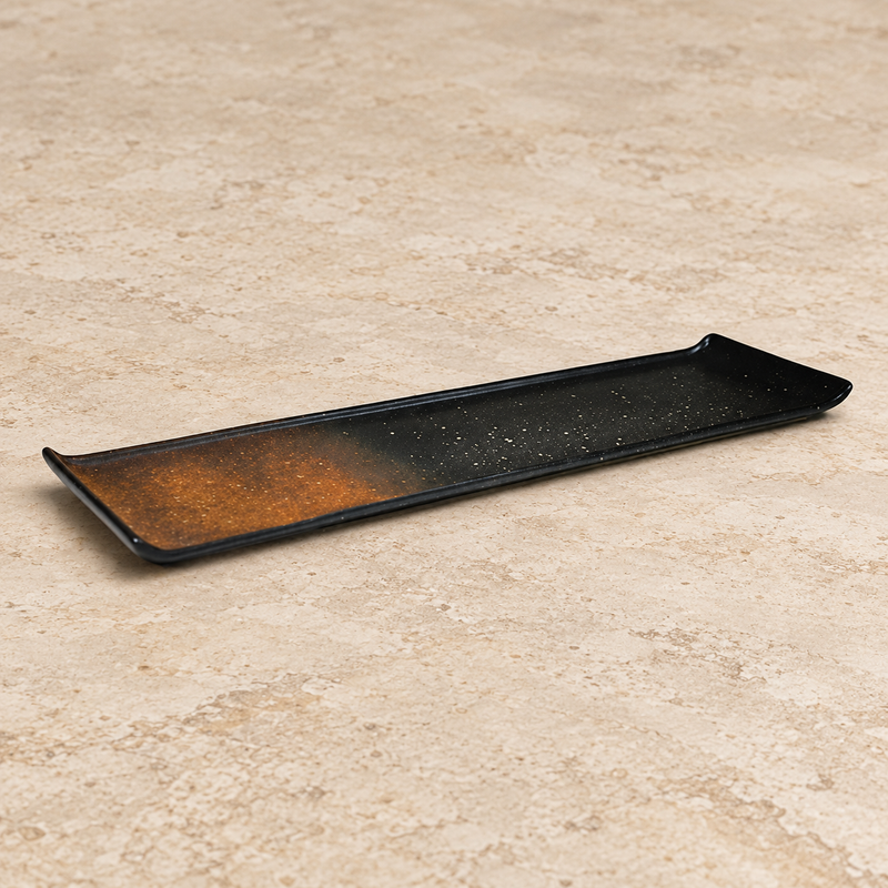 Ceramic serving dish on a neutral stone tabletop, same-view context