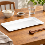 A239-01 white rectangular porcelain platter with rice bowl, soy sauce dish, water glass and chopsticks on a wood table