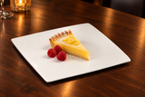 A2836 white flat square plate with lemon tart and raspberries.