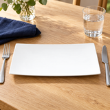 A346-02 white rectangular plate at an oak table setting with fork, knife, water glass and navy linen