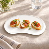 A391-02 white bean-shaped plate with tomato and mozzarella crostini