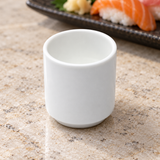 A3912 plain white sake cup on a pale stone table