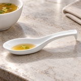 A5217 white ceramic soup spoon — broth tasting