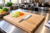 KAI Shoso AB5165 rectangular Chinese chef knife with silver textured handle at a kitchen preparation station
