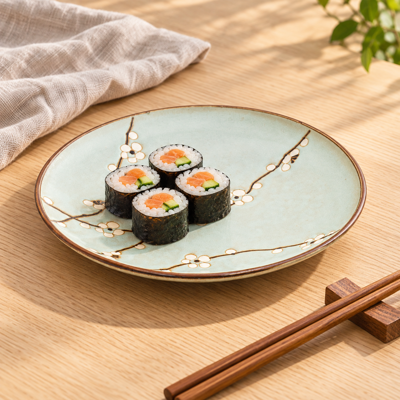 Q210-BP Aqua Blossom dinner plate with maki on an oak table
