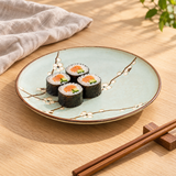 Q210-BP Aqua Blossom dinner plate with maki on an oak table