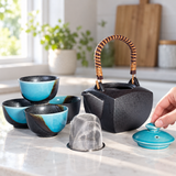 BD64-TK teapot and four cups with turquoise lid and mesh infuser during tea preparation