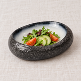 BK-3058 SeaCrest oval bowl with a modest salad serving