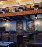 Brown Upholstered Restaurant Chair with Walnut-Finish Metal Frame in a restaurant setting; other furniture is illustrative