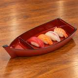 C100-R red lacquer sushi boat plate with nigiri on a wooden table