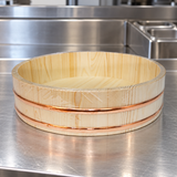 CK36 wooden sushi tub on a stainless preparation counter, original wrapping retained