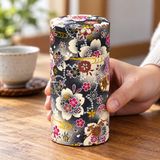 192HB0 patterned tea canister during handling; cup, linen and other scene accessories are not included.