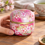 Pink floral tea container in a table setting. Contextual accessories are not included.