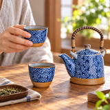 H2-19-11 blue fan-pattern tea set during cup serving; tabletop accessories illustrative.