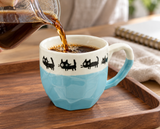 KM18-BC black-cat blue mug in a coffee preparation setting; contextual accessories not included.