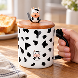 PC33-1 cow-pattern lidded mug in a breakfast table setting; contextual accessories not included.