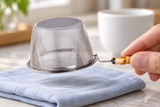 6592-75 stainless-steel tea strainer held inverted by its short bamboo grip; contextual accessories not included.