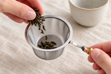 6592-85 open tea-strainer basket held while dry tea is added; tea and cup are not included.
