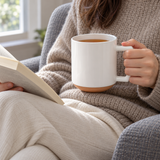 C008 white ceramic mug held with tea while reading