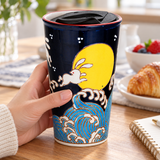 Rabbit and moon SM12-3355 tumbler held beside breakfast with lid seated