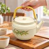 WH-11-6 bamboo-design teapot during handling; cups, tray and other scene accessories are not included.