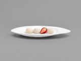 D105-05 white asymmetric oval plate with mochi and a strawberry half