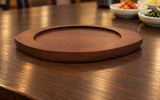 DH-WB28 wooden serving base on a dark dining tabletop; pan not included