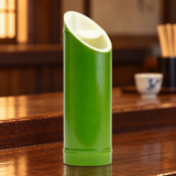 DJ-22AB-0018 green bamboo-shaped sake bottle on a wooden restaurant counter