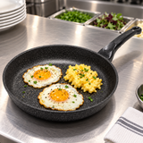 12" Durastone Marble Cast Aluminum Fry Pan with a finished egg preparation