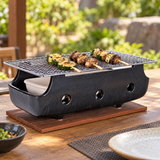 12.75" Charcoal Konro Grill with vegetable skewers on an outdoor table