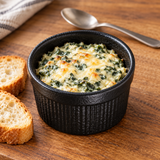 3½″ Textured Black Porcelain Ramekin — 6 oz with a small dip or sauce portion; table accessories shown separately