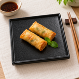 6″ Textured Black Porcelain Stackable Square Plate with a small appetizer portion; table accessories shown separately