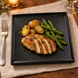 10″ Textured Black Porcelain Stackable Square Plate with a composed main course and sides; table accessories shown separately