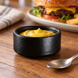 2½″ Textured Black Porcelain Stackable Butter Dish — 2 oz with a mustard portion; table accessories shown separately