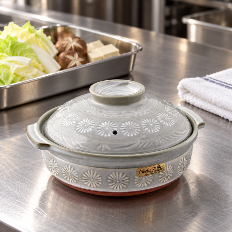 Mishima-pattern donabe beside ingredients for preparation