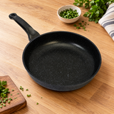 Joycook Durastone Marble Cast Aluminum Frying Pan 8" on a restaurant preparation counter