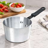 7 Qt Aluminum Sauce Pan with Bakelite Handle on a restaurant preparation counter