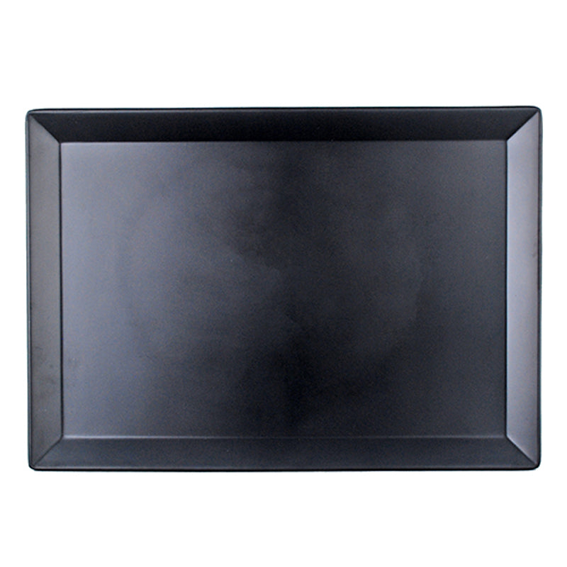 Overhead view of the rectangular black plate with its broad angled rim and recessed center