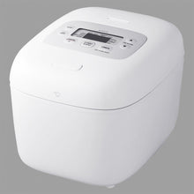 Zojirushi NL-EJC18 White Micom rice cooker in a front three-quarter view with a flat top, LCD control panel and hinged lid.