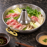 Aluminum Thai hot pot with soup around the center chimney