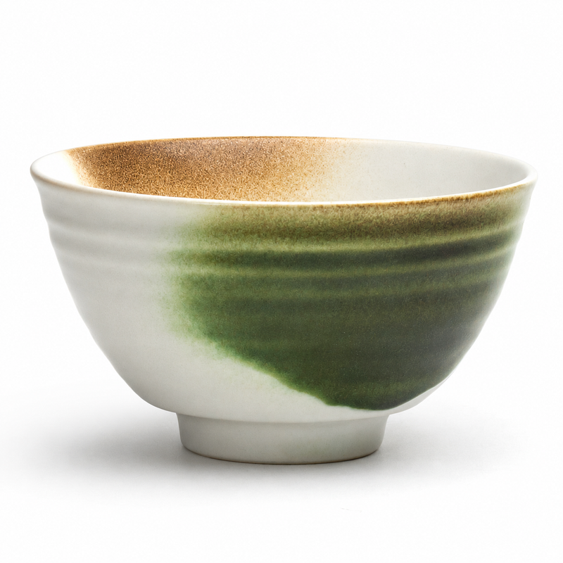 Side view of the white 0105 rice bowl with green and brown accents and a circular foot